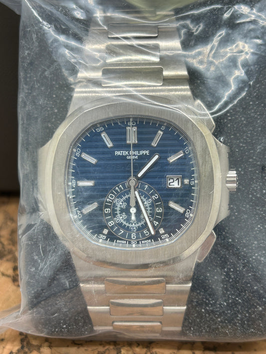Patek Philippe Nautilus 5976/1G Chrono 40th Anniversary - White Gold Blue Dial Baguette - Factory Sealed
